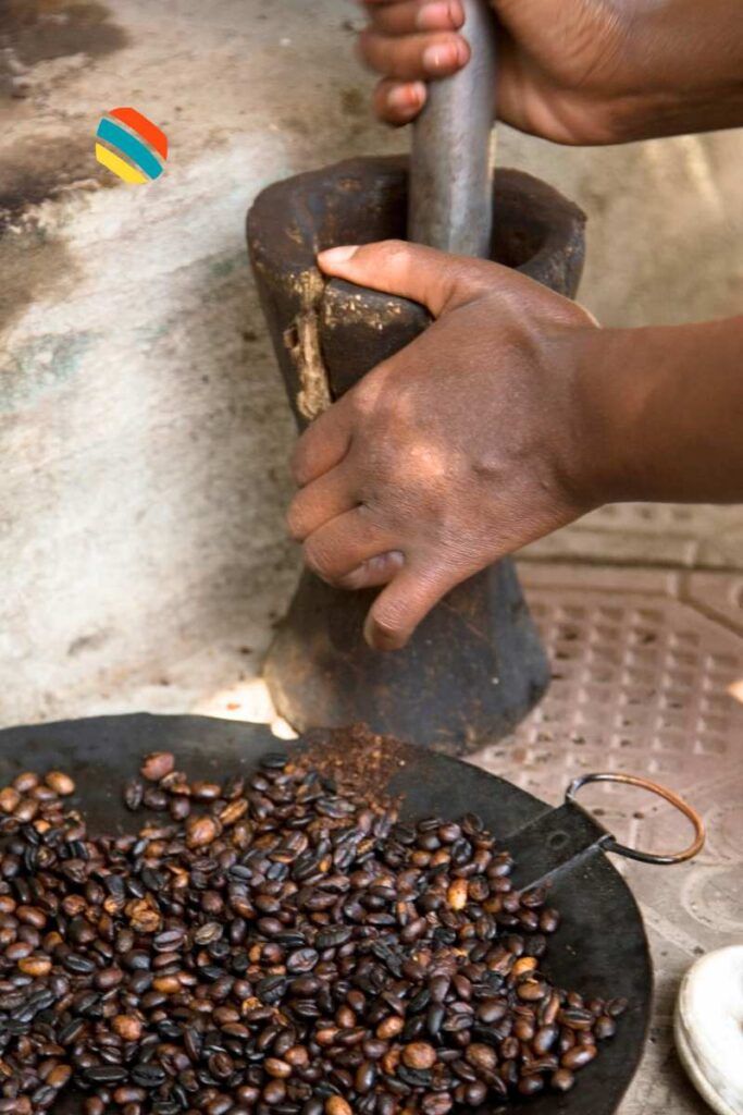 Ethiopian bunna. An Ethiopian woman processing coffee the traditional way