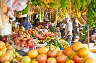 Kenya fruit market vendor