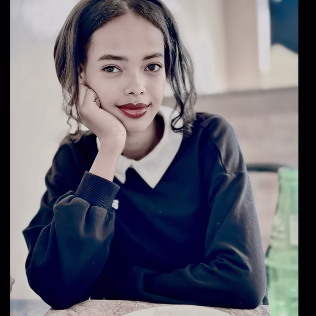 Ethiopian-Brand-Ambassador-Amen-studying-marketing-at-her-desk