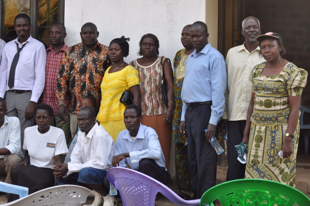 My Dad DD Oworobel and my step mum at the Ligingi Community Learning Centre with District Officials and Volunteers
